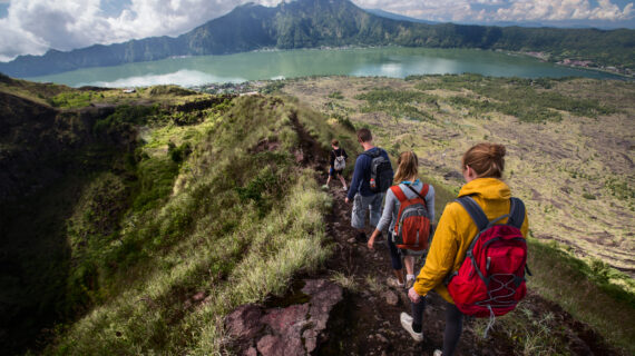 Group of hikers walking on the caldera of volcano of Batur, Bali, Indonesia